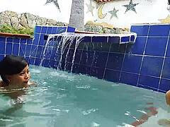 Indian mature and young Brazilian couple in the pool