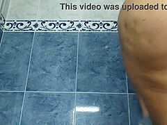 Home video of nurse changing clothes in bathroom