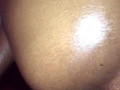 Closeup of a BBW's big black cock in action